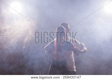 Young Couple Dancing Social Danse Kizomba Or Bachata Or Semba Or Taraxia In Dancing Class Background