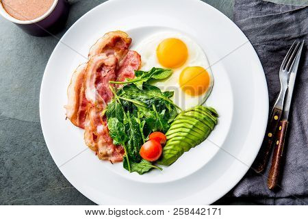 Ketogenic Diet Breakfast. Fried Egg, Bacon And Avocado, Spinach And Bulletproof Coffee. Low Carb Hig