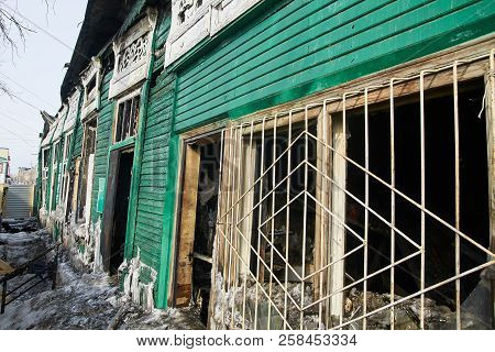 Demolition House Using Excavator In City. Rebuilding Process. Remove Equipment