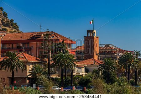 Colorful Old Buildings Perched Atop A Hill In The Medieval Town Of Vintimiglia In Italy, Just Across