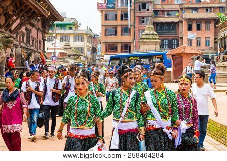 Group Of Dancers Wearing Traditional Costumes In Patan Durbar Square, Kathmandu Valley, Nepal