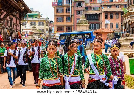 Group Of Dancers Wearing Traditional Costumes In Patan Durbar Square, Kathmandu Valley, Nepal