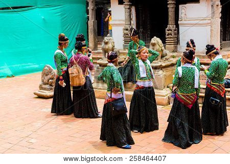 Group Of Dancers Wearing Traditional Costumes In Patan Durbar Square, Kathmandu Valley, Nepal
