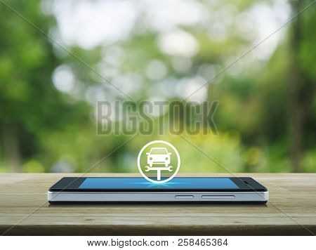 Service Fix Car With Wrench Tool Flat Con On Modern Smart Mobile Phone Screen On Wooden Table Over B
