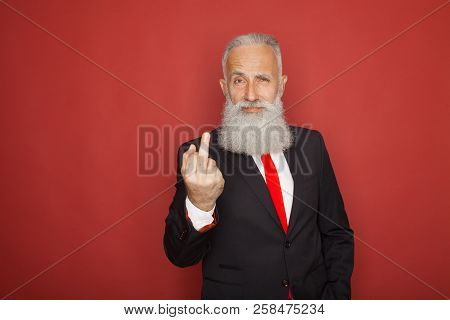 Old Bearded Businessman Showing Fuck Sign At Camera And Smiling. Business People Concept, Richly And