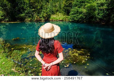 Girl Enjoying Day Outdoors At A Natural Water Well