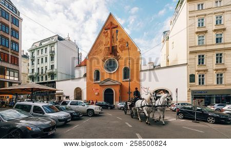 Vienna, Austria - 1 October, 2017: Horse-drawn Carriage Against Capuchin Church Which Houses Imperia