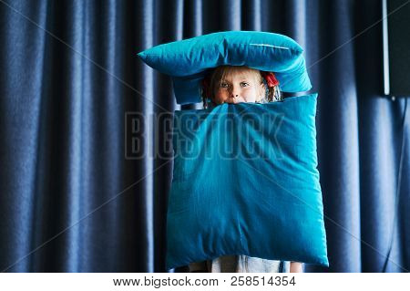 Little Girl Play With Pillow Hold Teeth