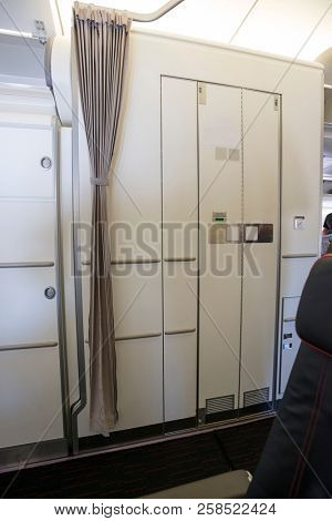 Airplane interior with lavatory.  