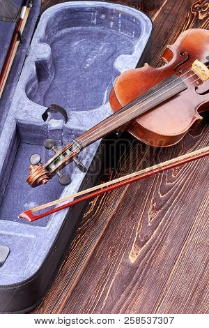 Old Violin On Wooden Background. Musical Instrument Violin And Open Case, Vertical Image.