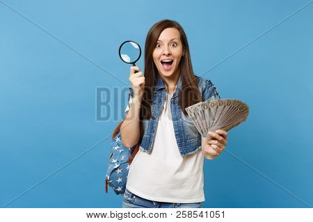 Young Shocked Excited Woman Student With Backpack Holding Bundle Lots Of Dollars Cash Money And Magn