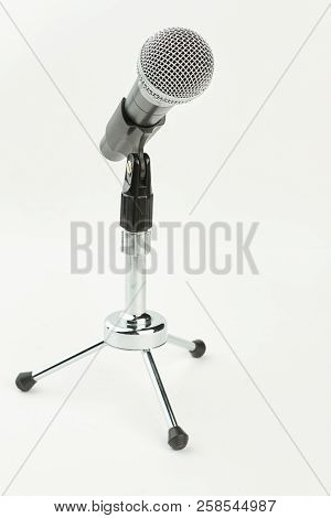 Gray Microphone On Short Stand. Mini Microphone Isolated On White Background. Professional Audio Ins