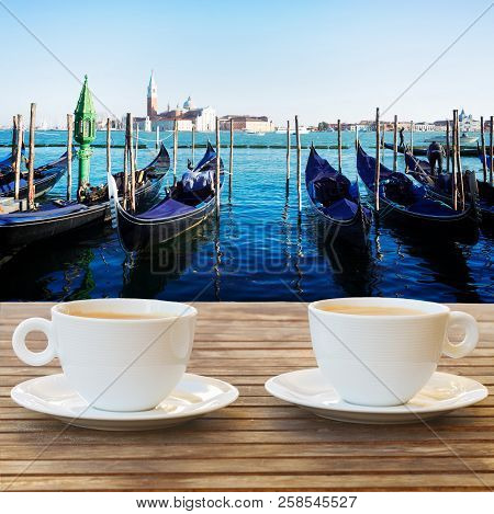Cup Of Coffee With View Of Gondolas Floating In The Grand Canal, Venice Italy