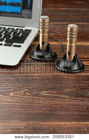 Mini Stereo Microphones, Laptop And Copy Space. Silver Laptop And Professional Stereo Microphones On