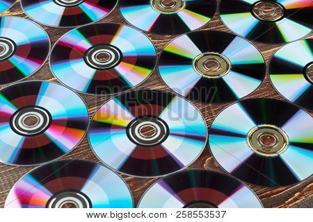 Background Of Colorful Compact Discs. Lots Of Colorful Compact Disks. Digital Storage Of Information