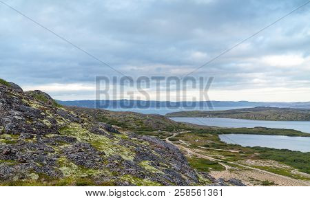 The Chain Of Lakes In The Tundra Of The Kola Peninsula In Inclement Weather, Green Moss And Lichens,