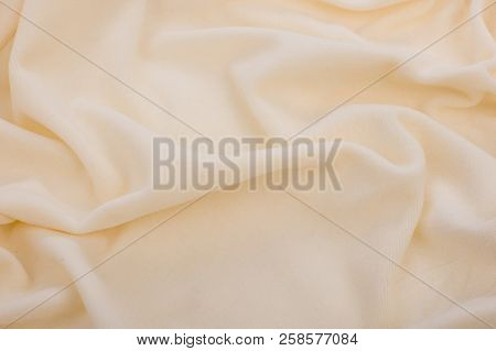Abstract Texture Of A Fleecy Fabr. Natural Cream Fabric Background.