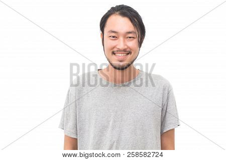 Portrait Of A Asian Young Handsome Man Smiling While Standing Isiolated On White Background