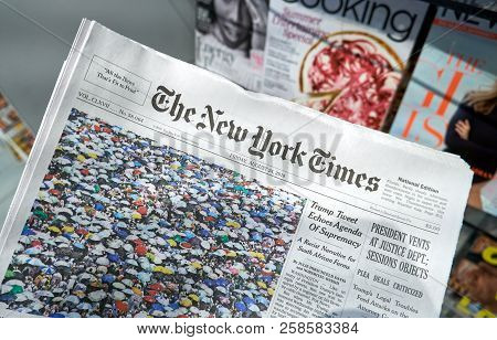 Miami, Usa - August 22, 2018: The New York Times Newspaper In A Hand. The New York Times Is A Popula