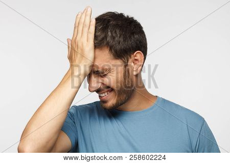 Face Palm Concept. Stressed Out Young Guy Making Facepalm Gesture With Hand.
