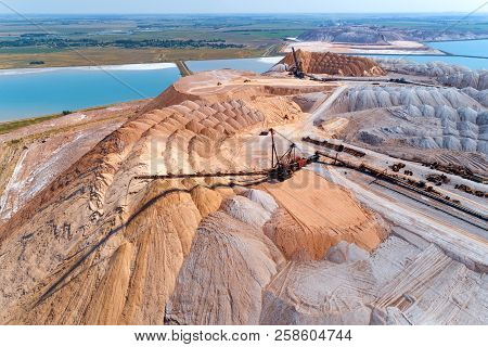 An Industrial Spreader In The Process Of Work. The Process Of Pouring Rock Piles.