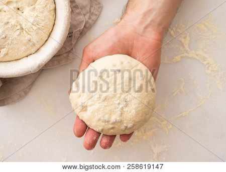 Hands Holding Dough Ready For Baking, Closeup, Copy Space.