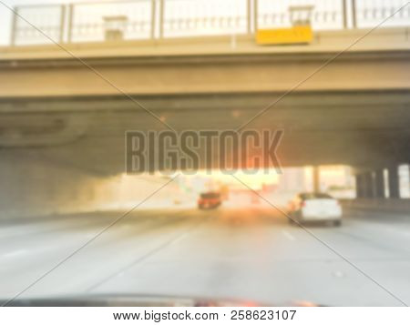Blurry Background Highway Traffic With Bridge Grade Separation At Sunrise In Usa