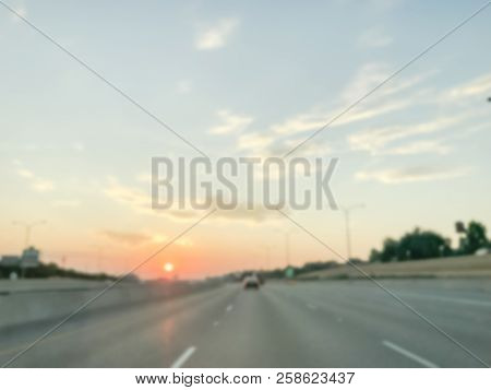 Blurry Background Usual Traffic Condition On Highway Interstate At Sunrise In Usa
