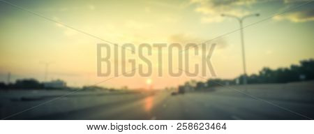 Panoramic Blurry Background Usual Traffic Condition On Highway Interstate At Sunrise In Usa