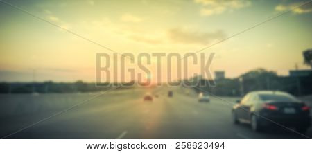Panoramic Blurry Background Usual Traffic Condition On Highway Interstate At Sunrise In Usa