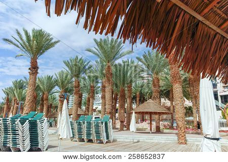 Beautiful Public Sandy Beaches On Red Sea In Eilat With Stro Umbrellas, Luxury Vacation Spa Resorts