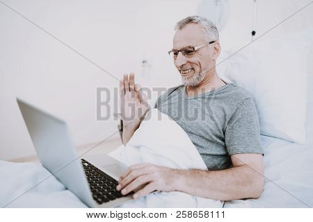 Laptop Wit Patient In Clinick. Businessman In Hospital With Laptop. Rehab In Clinic. Rehab In Hospit