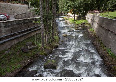 Mountain River In Resort Sairme. Beautiful River Clear Water Flowing Through Stones. Clean Mountain 