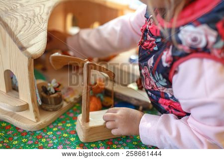 Concentrated Boy Puts Colorful Coins During Aba