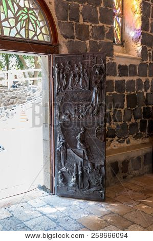 Tiberias, Israel, September 10, 2018 : Decorated With Bas-reliefs, The Front Door To The Church Of T