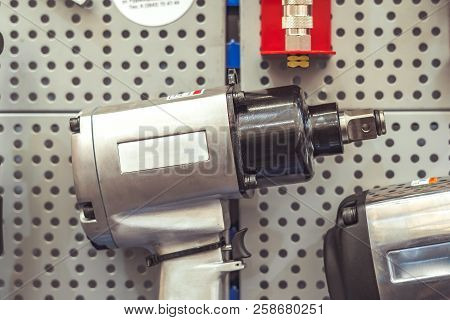 Electric Tools For Construction On The Stand In The Shop