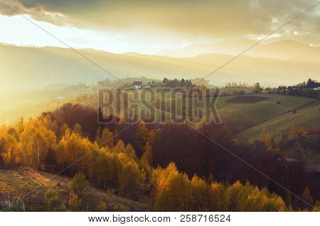 Magic Autumn Sunset Light In Transylvania. Warm October Evening
