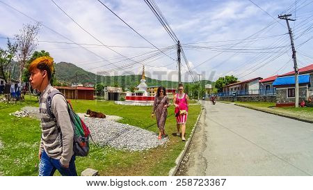 Pokhara, Nepal - April 10, 2018: The People Near Stoned Sculpture Of Namgyal Chorten At Nepal
