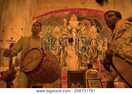 Kolkata , India - September 27, 2017 : Young Dhaakis (drummers) Performing - Durga Puja Festival Rit