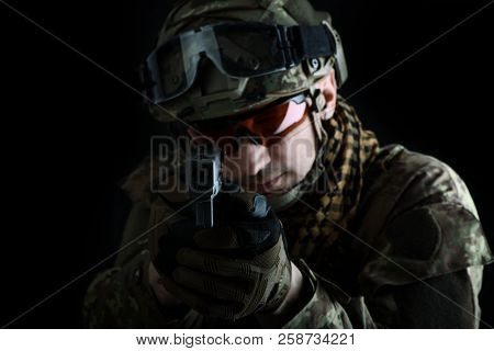 Aiming At The Camera Focus On The Muzzle Of Gun