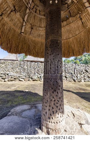 A Carving Supporting A Thatched Ngadhu In The Luba Traditional Village In Flores, Indonesia.
