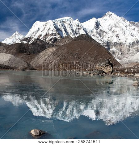 View Of Cho Oyu Mirroring In Lake - Cho Oyu Base Camp - Everest Trek - Nepal Himalayas Mountains