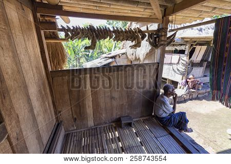 Luba, Indonesia - May 19: An Unidentified Man Sits On His Front Porch On May 19, 2017 In Luba, Indon