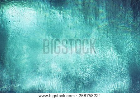 Blue-green Ice Wall Tuxture. Frozen Water, Lights.