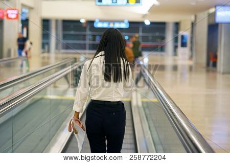 Women At Horizontal Escalator Covered. Moving Walkway, Moving Sidewalk, Moving Pavement, Autopedesca