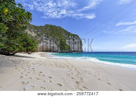 Footprints In The Sand At Kelingking Beach On Nusa Penida In Indonesia.