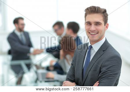 Business partners shaking hands over business objects on workpla