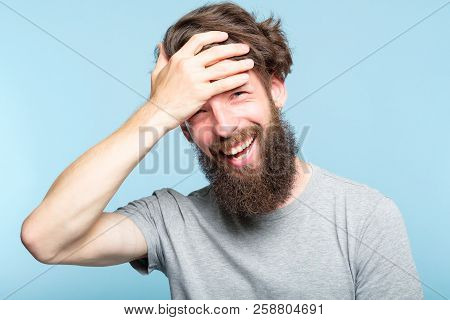 Facepalm. Happy Smiling Joyful Man Covering His Face. Shame And Embarrassment Concept. Portrait Of A