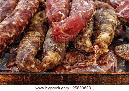 Closeup, Assorted Different Kinds Of Meat: Salami, Sausages, Smoked Meat.