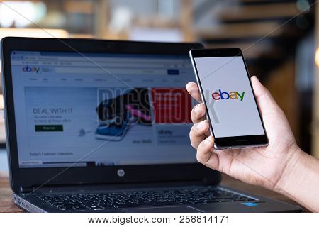Chiang Mai, Thailand - Sep. 08,2018: Man Hands Holding Huawei With Ebay Apps On The Screen. Ebay Is 